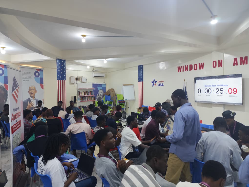 Participants working on laptops during Gemini Hack FUTMinna, with a countdown timer on screen