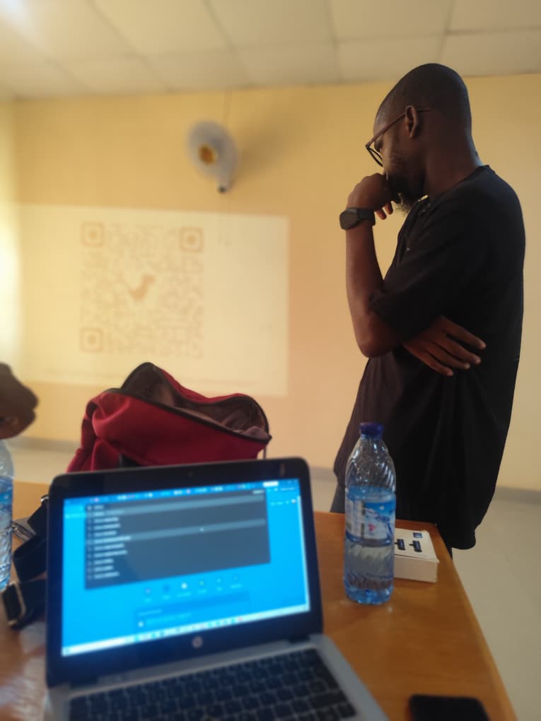 Rasheed observing staff working through SWEMLab during the workshop
